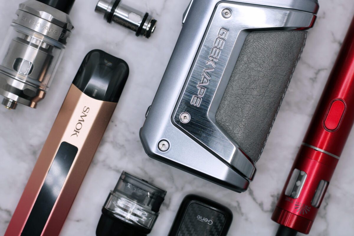 An Introduction to E-cigarettes - graphic - kits, hardware, coils, pods laid out